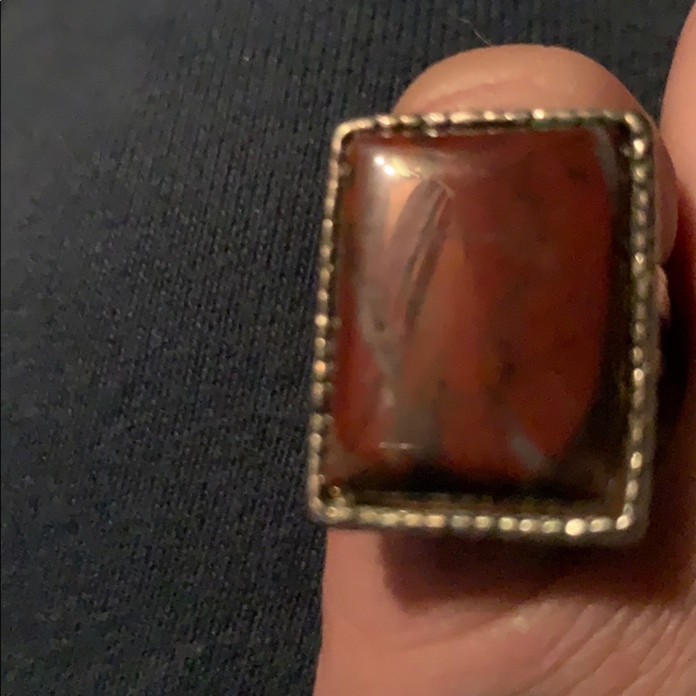 Silver ring with natural coral colored stone